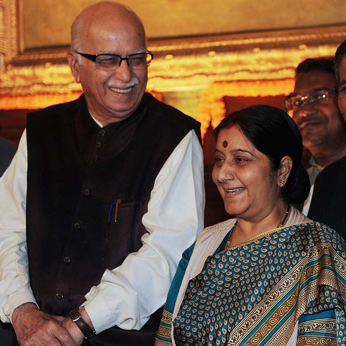 Opposition Bharatiya Janata Party (BJP) leader Lal Krishna Advani (L) and leader of the opposition Sushma Swaraj pose at parliament house in New Delhi on March 23, 2011.<br /><br /> The ruling government and opposition clashed over the timing of debate on Prime Minister Manmohan Singh's statement March 22 on the 'cash-for-votes' scam where the BJP gave notice for Breach of Privilege against the Prime Minister, alleging that he had misled the parliament by denying bribery during the 2008 Confidence Motion to save the Congress-led UPA government. (AFP)