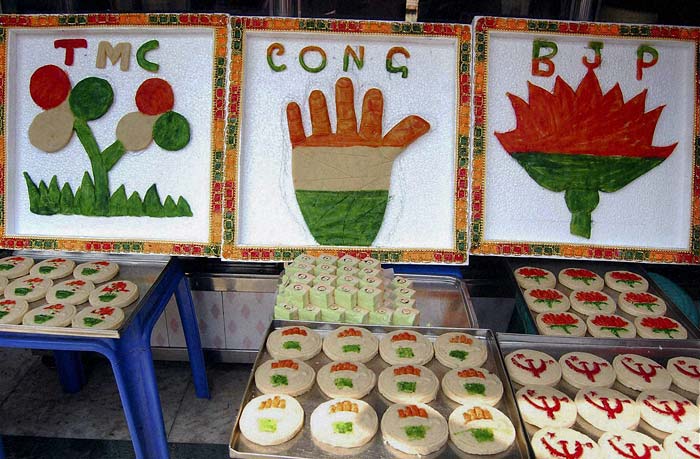 Sweets bearing different political symbols displayed at a shop to attract customers at the Howrah district ahead of the West Bengal assembly elections. (PTI)