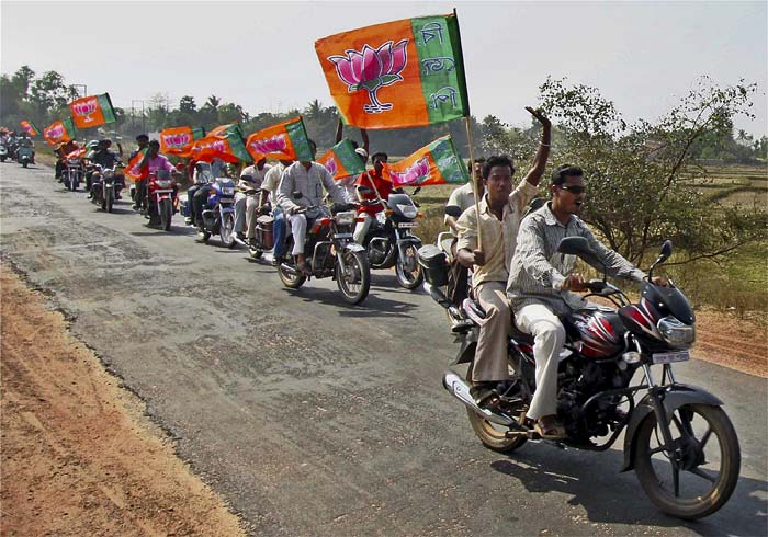 Supporters of Dilip Ghosh, the BJP candidate from the Bolpur constituency, take part in a motorcycle rally in the Birbhum district as part of his election campaign ahead of the West Bengal assembly elections. (PTI)