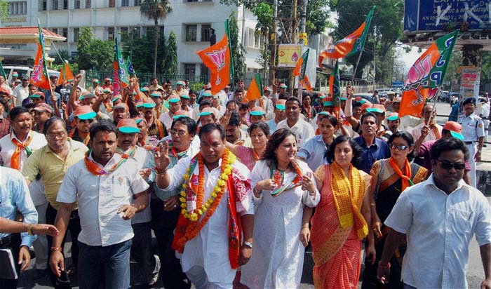 Ranjit Rahand, the BJP candidate from Dispur, on his way with his supporters to file nomination papers in Guwahati for the upcoming Assam assembly elections. (PTI)