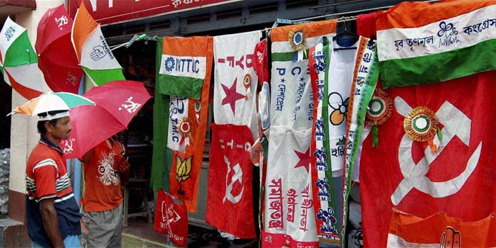 A vendor selling flags of political parties at Krishnanagar for the campaigns ahead of the West Bengal assembly elections. (PTI)