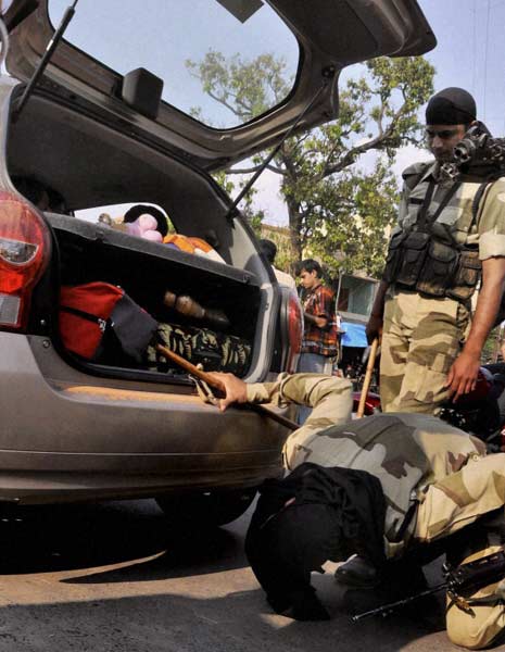 CISF personnel checking a car at Berhampore in Murshidabad as part of security measures for the upcoming West Bengal assembly elections. (PTI)