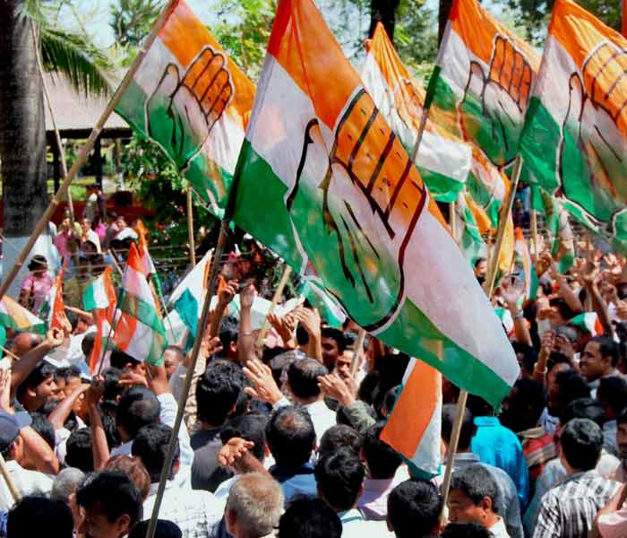 Congress supporters in the Sivasagar district during the last day of filing nomination papers for the upcoming Assam assembly elections. (PTI)