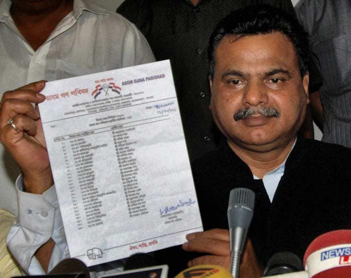 Asom Gana Parishad (AGP) President Chandra Mohan Patowary releases the fourth list of candidates for the forthcoming assembly elections in Assam during a press conference in Guwahati. (PTI)