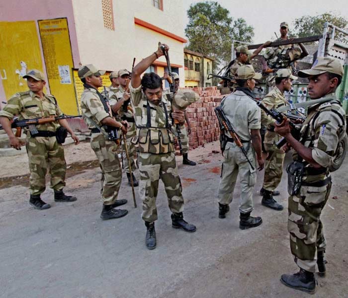 CISF personnel arrive at Papuri village in Birbhum district, one of the troubled areas of West Bengal, for the upcoming state assembly elections. (PTI)