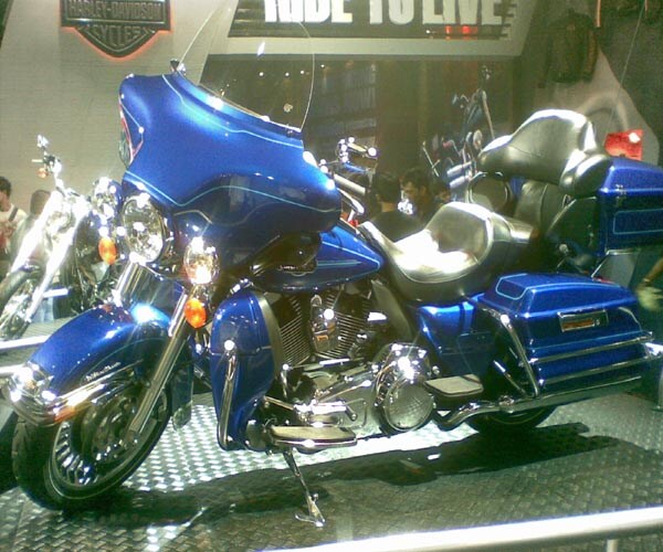 The iconic American motorcycle brand Harley Davidson has arrived in India, and they have arrived in style. At the Auto Expo'10, Harley made its presence felt by displaying this mammoth on two wheels ? Electra Glide.<br><br>This ultimate touring machine can keep going on all day without breaking a sweat. Carry your luggage along in its huge compartments and keep your pillion happy in its comfortable seats.<br><br>But, all good things come at a price and this one is no different, costing an eye watering Rs 36 lakh. (NDTV Photo)
