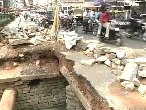 <p>Construction work eats up what was once a proper stretch of road, in Bangalore. (NDTV Photo)</p>
<div><font face="Arial" color="#000000" size="2"></font></div>
<a class="fn fl fa fs12" target="_Blank" href="http://www.ndtv.com/convergence/ndtv/new/india.aspx">Seen worse roads? Share pictures with us.</a>