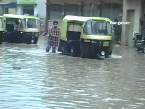 <p>Roads are nowhere to be seen, after a heavy downpour. It is a struggle to walk amidst all the water, in Bangalore. (NDTV Photo)</p>
<div><font face="Arial" color="#000000" size="2"></font></div>
<a class="fn fl fa fs12" target="_Blank" href="http://www.ndtv.com/convergence/ndtv/new/india.aspx">Seen worse roads? Share pictures with us.</a>