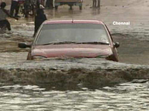 <p>A car struggles through a road immersed under water, in Chennai. (NDTV Photo)</p>
<p><br />
</p>
<a class="fn fl fa fs12" target="_Blank" href="http://www.ndtv.com/convergence/ndtv/new/india.aspx">Seen worse roads? Share pictures with us.</a>