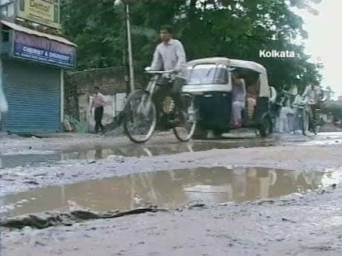 <p>A road lies ragged in shreds- in Kolkata. (NDTV Photo)</p>
<div><font face="Arial" color="#000000" size="2"></font></div>
<a class="fn fl fa fs12" target="_Blank" href="http://www.ndtv.com/convergence/ndtv/new/india.aspx">Seen worse roads? Share pictures with us.</a>