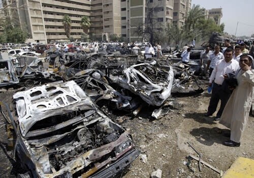 <span class="lh16 fa fs12 fb"><strong>Blown to shreds:</strong> People gather at the scene of a massive explosion outside the foreign ministry. (AFP)</span>