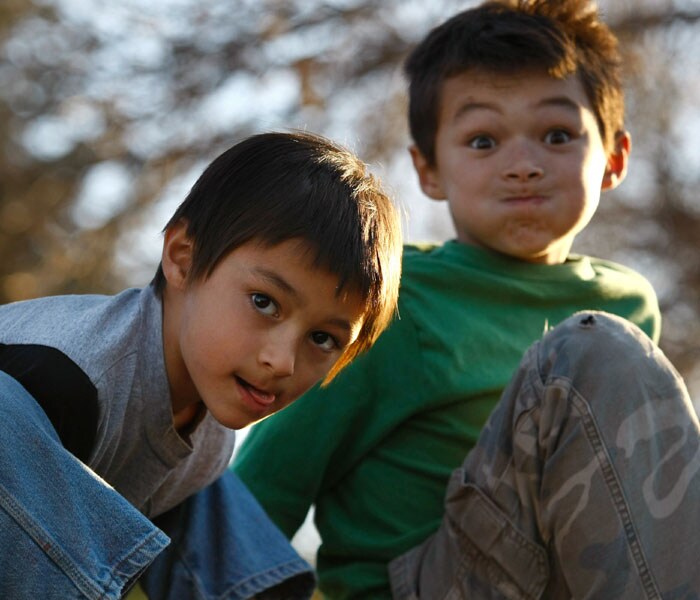 Falcon Henne (L) and brother Ryo, 8, seen outside their home. (AFP Photo)