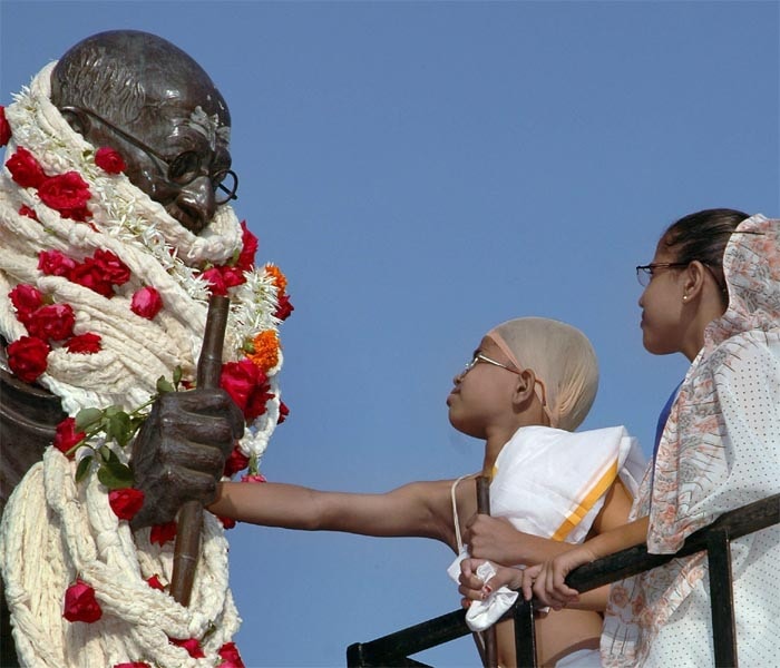 <strong>Gandhi junior meets senior:</strong> Children dressed as Mahatma Gandhi and Kasturba Gandhi pay tribute to the Father of the Nation on the occasion of Gandhi Jayanti in Surat. <em>(PTI)</em>