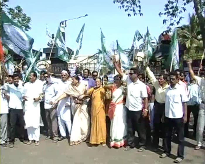 Crowds led by women protested holding huge green and red flags and banners.