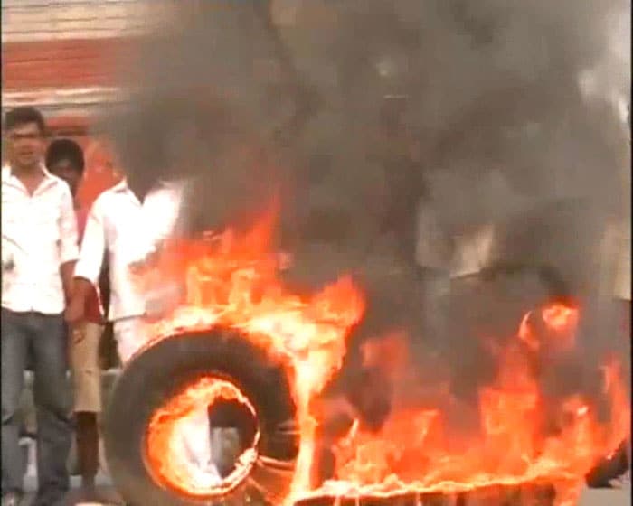 Agitated with the price hike, people burnt tyres in Patna.