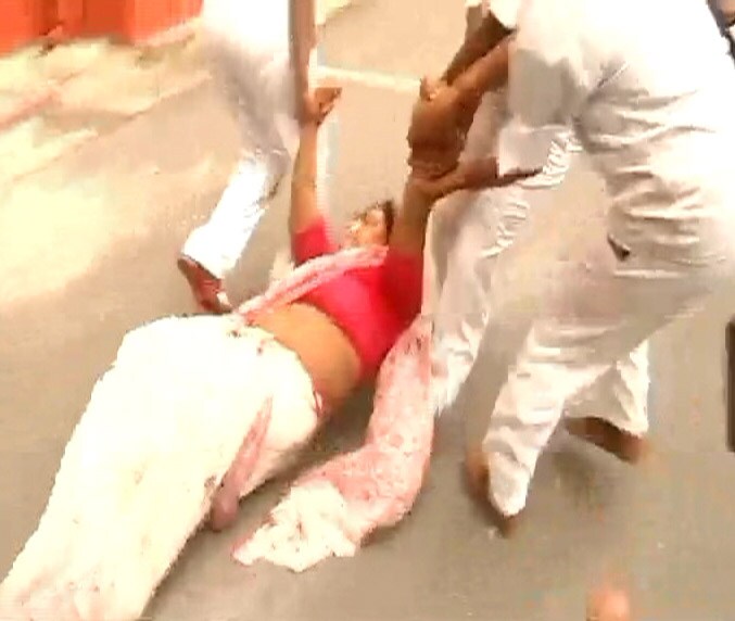 An adamant Singh refused to budge as security guards dragged her away from the Assembly.