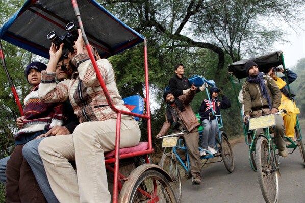 Bird watchers at Keoladeo National Park in Bharatpur.<br><br>If the rains are good and Keoladeo's lakes are full, the park in winter can host close to 400 species. (Courtesy: NYT)