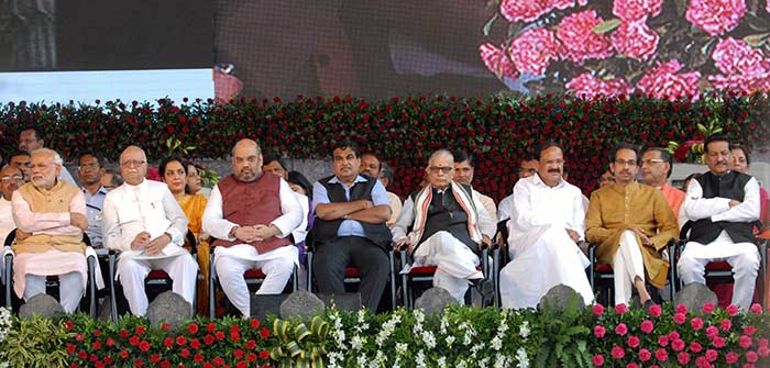 PM Modi and Shiv Sena chief Uddhav Thackeray were seated five places apart at the swearing-in ceremony (Credit: Press Information Bureau)