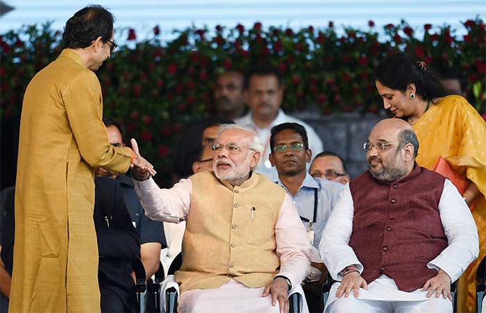 Shiv Sena's Uddhav Thackeray exchanged a few words with PM Modi at the ceremony (Credit: Press Trust of India)