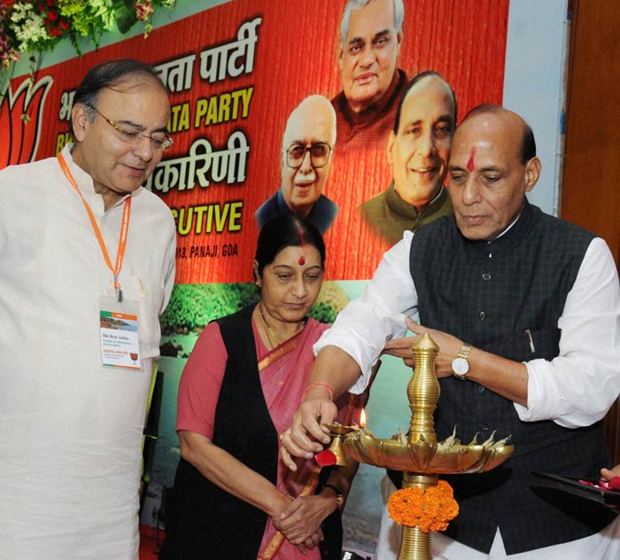 BJP President Rajnath Singh (R) lighting the lamp along with party leaders Arun Jaitley (L) and Sushma Swaraj at the inauguration of the BJP National Executive Meet.