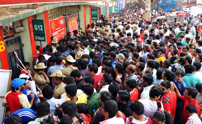 There have been two low-intensity explosions outside gate no 12 of Chinnaswamy stadium in Bangalore, minutes before an IPL match was to begin.<br><br>Eight people have been injured, including some policemen.<br><br>An IPL match between Royal Challengers Bangalore and Mumbai Indians was scheduled to be played at the stadium today. The match was to begin at 4 pm and the stadium was packed about 40,000 people. There is huge security at the stadium.<br><br>The toss, which was to have taken place at 3:30 pm, has been delayed. The players were asked to go back to the dressing room for 10 minutes, but they are back on the ground warming up now. (AFP Photo)