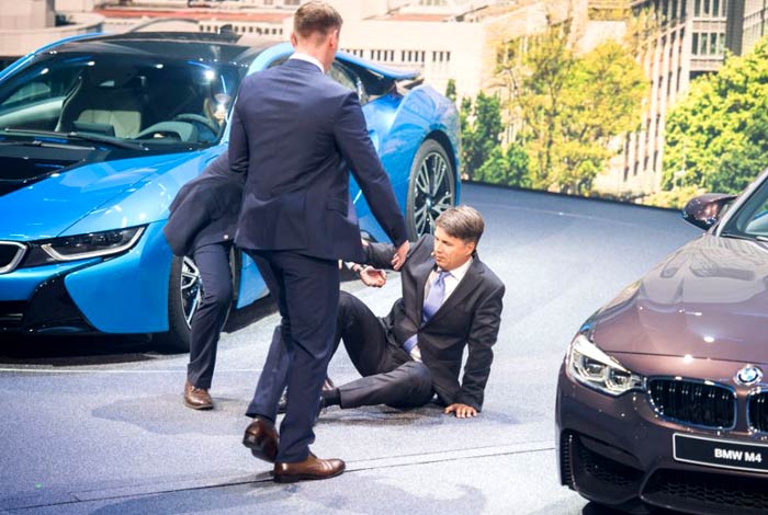 Two men escorted him off stage. He was able to walk.