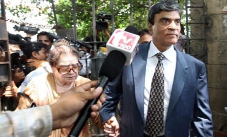 <b>Shocked:</b> Sanjeev Nanda's father, Lieutenant Commander Suresh Nanda, and grandmother come out of the Patiala House court on September 2, 2008. (AFP)