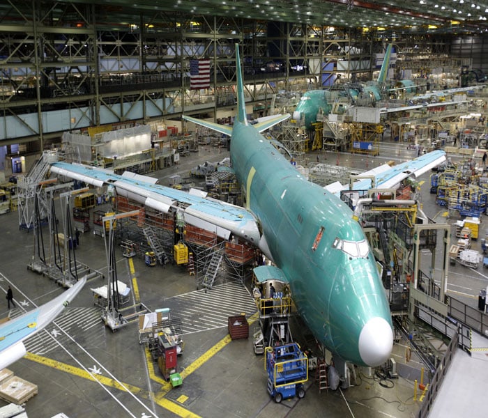 Boeing is also developing a passenger version of the plane. It lists 76 orders for the freighter and 32 for the 747-8 passenger jet, with the vast majority from international customers.<br><br>According to Boeing, the jets will be much quieter, more fuel efficient and have lower emissions than current 747-400 models.<br><br>In this picture, Boeing's 747-8 Freighter airplanes are shown on the factory floor.(AP Image)