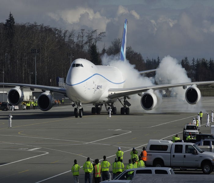 At 250 feet long, the plane is about 18 feet longer than the existing 747-400 jumbo jet. Seen here, Boeing's jumbo jet at the runway, ready for its first take-off. (AP Image)