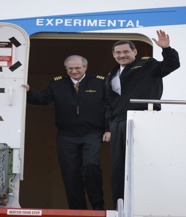 Captain Mark Feuerstein, right, Boeing Company's chief 747 pilot, and first officer Captain Tom Imrich exit Boeing 747-8 Freighter after flying it for the airplane's inaugural test flight.(AP Image)