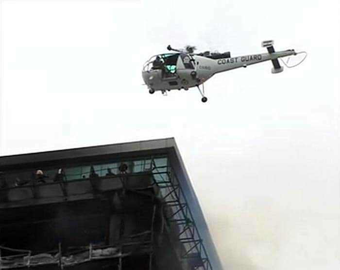 As many as 30 firemen were trapped inside the building while trying to douse fire.