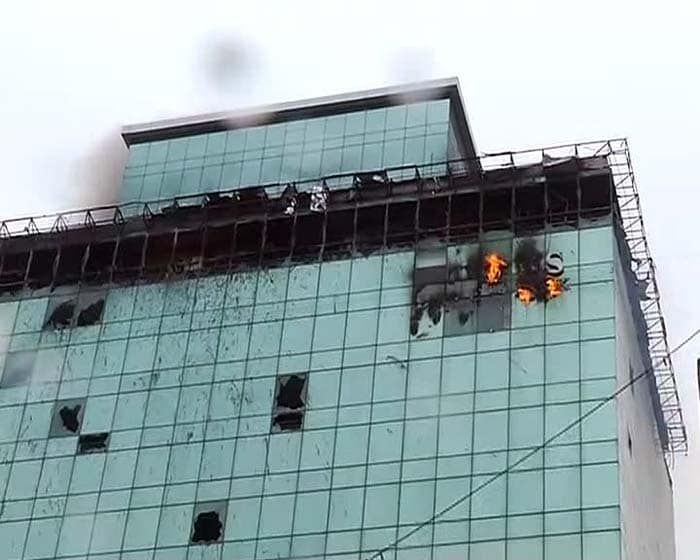 The fire started in the 22-storey Lotus Business Park at around 11 am and destroyed to top two floors before the fire personnel brought it under control.