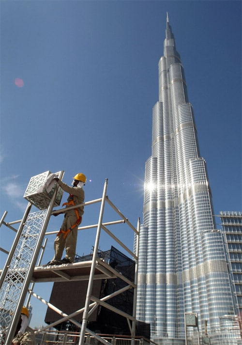 The move is being considered a bold feat on the world stage, despite the city state's shaky financial footing. The Burj's developer, Emaar Properties, kept pushing the design higher even after construction began. (AFP Image)