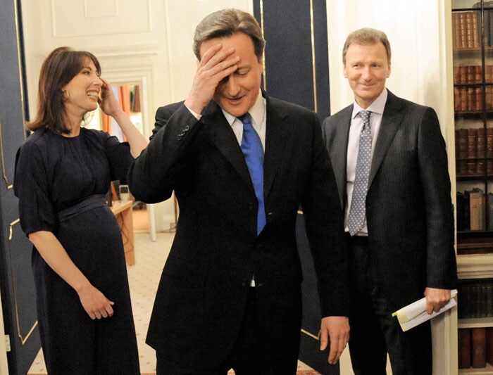 The smooth, self-assured Cameron moved swiftly to weed out the old guard, replacing the party's mean-spirited image with a kinder, more socially progressive philosophy that he called compassionate Conservatism.<br><br>In this picture, David Cameron and his wife Samantha meet Cabinet Secretary Gus O'Donnell in the Cabinet Room of 10 Downing Street. (AP Image)