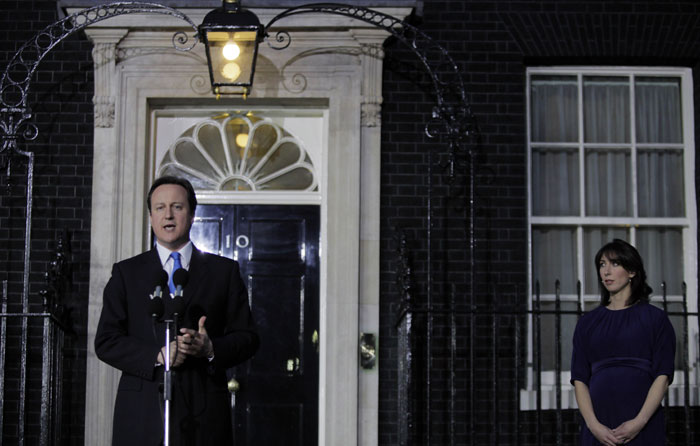 Within minutes, the 43-year-old Cameron was installed at No. 10 Downing Street, becoming the youngest Prime Minister in almost 200 years, since Lord Liverpool took office at age 42. (AP Image)