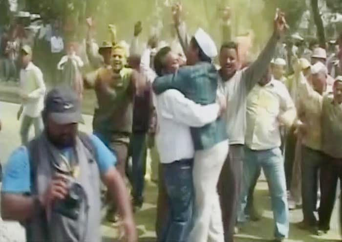 Congress party workers celebrate in Haldwani, as their leader Indira Hridesh won the elections from the constituency.