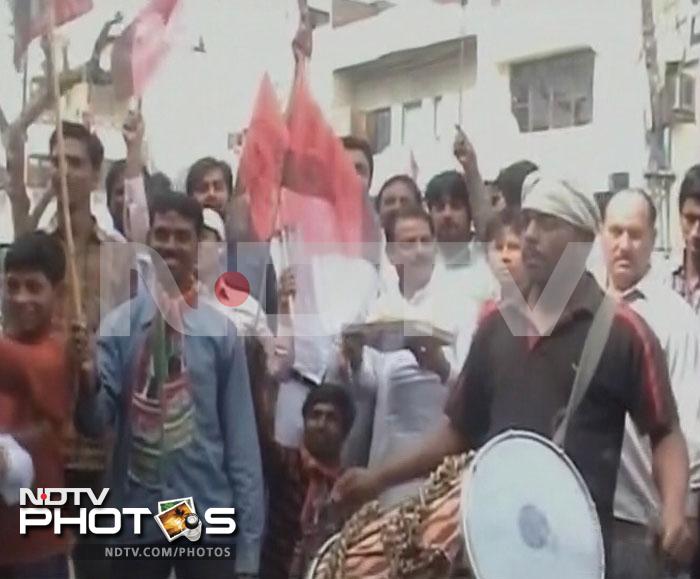 Supporters of Samajwadi Party celebrate in Meerut.