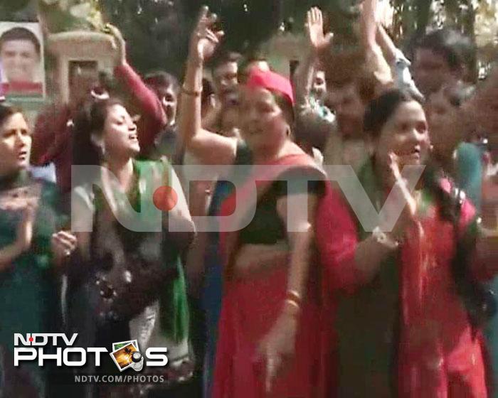 Women workers of the Samajwadi Party celebrate in Lucknow.