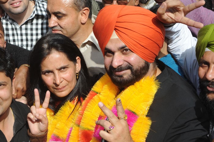 Former cricketer and BJP MP Navjot Singh Sidhu celebrates his wife's win from Amritsar (East), Punjab. His wife, also called Navjot, has won on a BJP ticket as well.