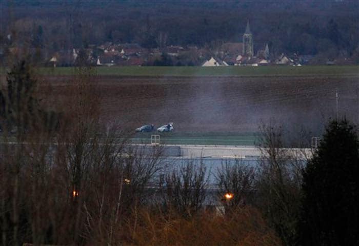 Smoke rises from a building in Dammartin-en-Goele, northeast of Paris, where the two brothers suspected in a deadly terror attack were cornered on Friday. (Associated Press)