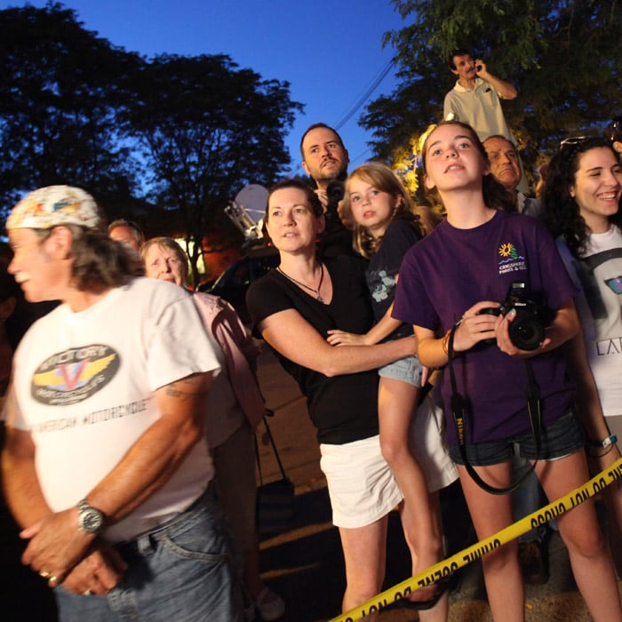 The fan out pour kept security officials on their toes. People gathered outside the venue and waited for long hours hoping to get a glimpse of the celebs and guests arriving for the wedding. (AP Photo)