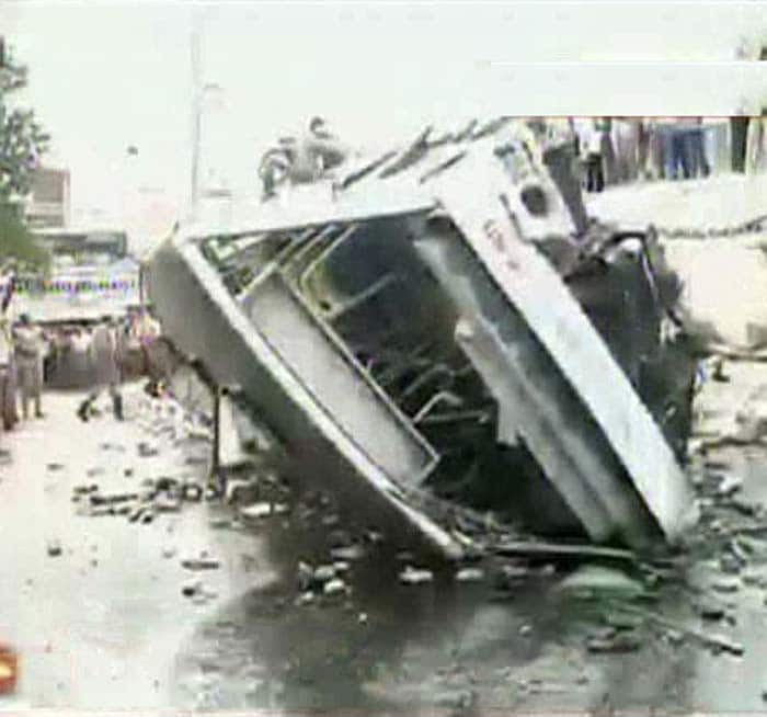 The bus is lying on its side, shattered glass and crowds of people around it. Fire and rescue teams have climbed atop the bus now and are trying to remove the bus. The Gemini flyover is in the middle of Chennai close to the US embassy.