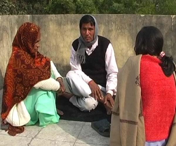The headmaster, accused of beating her to death, on Friday was seen soaking up the sun on the roof of the very police station where he should have been imprisoned.(NDTV Photo)