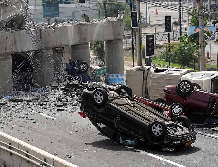 Powerful aftershocks rattled Chile's coast - 41 of them magnitude 5 or greater - in the 10 hours after the quake. Six were sizable quakes in their own right, magnitude 6 or greater.<br><br>Cars are seen flipped over after a bridge collapsed in Santiago due to the earthquake in Chile. (AFP)