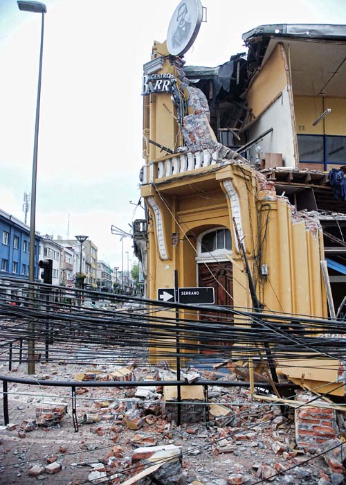 A building is seen destroyed at an intersection in Concepcion.(AFP Image)