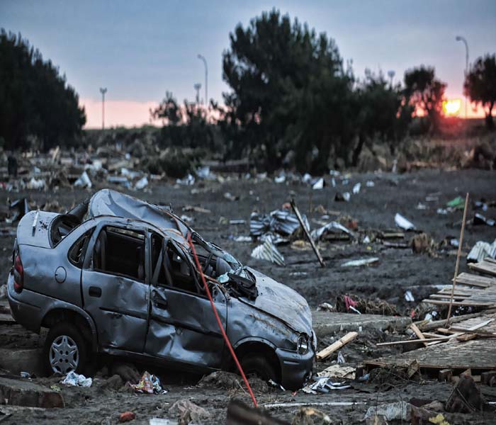 Picture showing the massive destruction caused by a tsunami in the Chilean city of Dichato, some 30 km from Concepcion.(AFP Image)