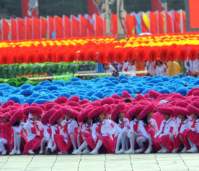 <p>Chinese children dressed in costumes wait on Tiananmen Square for the National Day parade to start in Beijing on October 1, 2009. China celebrated 60 years of communist rule with a massive military parade and elaborate pageantry on Beijing's Tiananmen Square showcasing the nation's revival as a global power. AFP PHOTO </p>
<a class="text2bold_link" href="http://www.ndtv.com/convergence/ndtv/new/NDTV-Show-Special.aspx?ID=362">China at 60: Live Blogs</a>