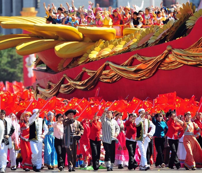 <p>People perform during National Day celebrations in Beijing on October 1, 2009. China formally kicked off mass celebrations of 60 years of communist rule with a 60-gun salute that rung out across Beijing's historic Tiananmen Square but due to security concerns most of Beijing's 17 million citizens were relegated to watching the pageant in their hometown on television like the rest of China. AFP PHOTO</p>
<a class="text2bold_link" href="http://www.ndtv.com/convergence/ndtv/new/NDTV-Show-Special.aspx?ID=362">China at 60: Live Blogs</a>