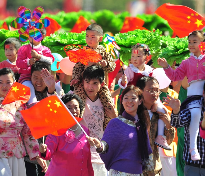 <p>People take part in National Day celebrations in Beijing on October 1, 2009. China formally kicked off mass celebrations of 60 years of communist rule with a 60-gun salute that rung out across Beijing's historic Tiananmen Square but due to security concerns most of Beijing's 17 million citizens were relegated to watching the pageant in their hometown on television like the rest of China. AFP PHOTO</p>
<a class="text2bold_link" href="http://www.ndtv.com/convergence/ndtv/new/NDTV-Show-Special.aspx?ID=362">China at 60: Live Blogs</a>