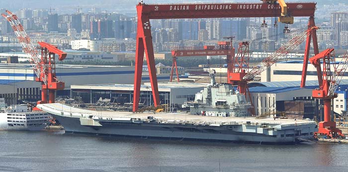 China's first aircraft carrier swept through fog-shrouded waters on Wednesday to open sea trials that underscore concerns about the country's growing military strength and its increasingly assertive claims over disputed territory.<br><br>The mission by the refurbished former Soviet carrier marks a first step in readying the craft for full deployment. China says the ship is intended for research and training, pointing to longer-term plans to build up to three additional clones of the carrier in China's own shipyards.